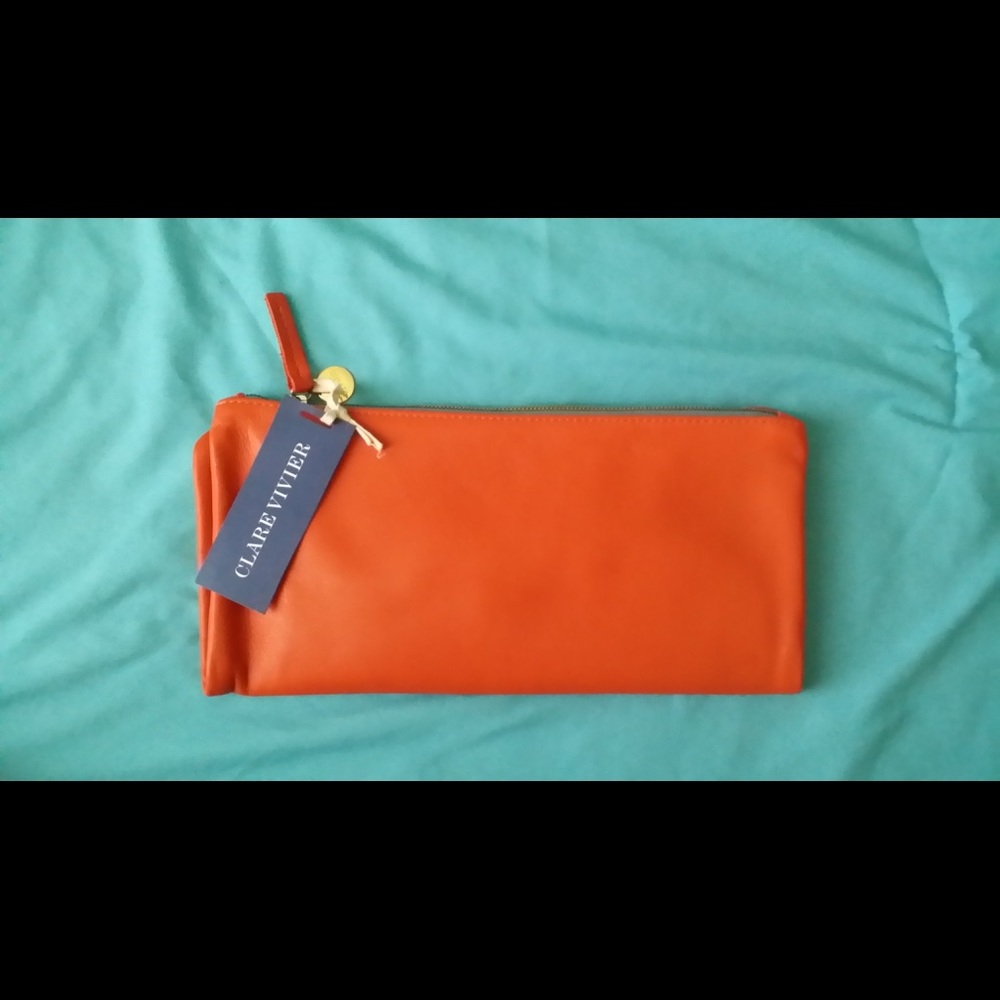 Clare Vivier leather orange foldover clutch